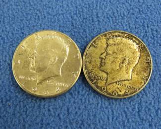 Lot 77. Two silver 1964 Kennedy half dollars