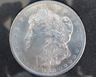 Lot 152. 1882 CC uncirculated Morgan silver dollar in a GSA presentation case