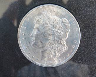 Lot 155. 1883 CC uncirculated Morgan silver dollar in a GSA presentation case