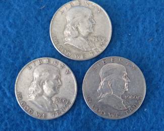Lot 275. Three Franklin half dollars