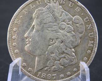 Lot 9. 1897 O Morgan silver dollar