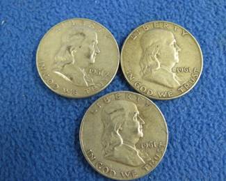 Lot 61. Three Benjamin Franklin silver half dollars