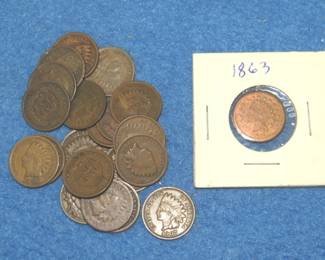Lot 300. 20 Indian Head pennies and an 1863 Francis Eccard trade token from Detroit.