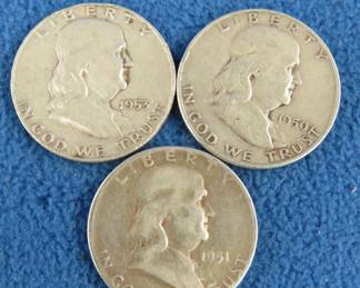 Lot 28. Three Benjamin Franklin silver half-dollars
