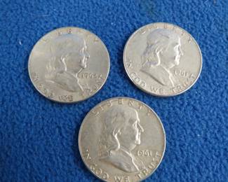 Lot 62. Three Benjamin Franklin silver half dollars