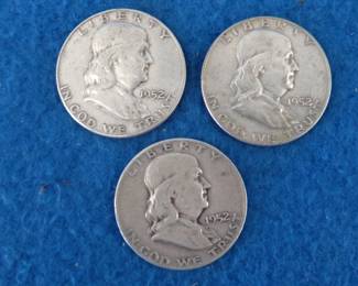 Lot 163. Three Franklin half dollars