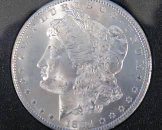 Lot 159. 1884 CC uncirculated Morgan silver dollar in a GSA presentation case