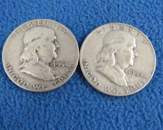Lot 67. Two Benjamin Franklin silver half dollars