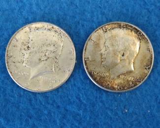 Lot 212. Two 1964 90% silver Kennedy half dollars
