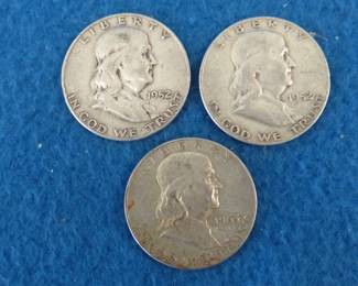 Lot 165. Three Franklin half dollars