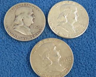 Lot 27. Three Benjamin Franklin silver half-dollars