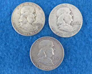 Lot 164. Three Franklin half dollars