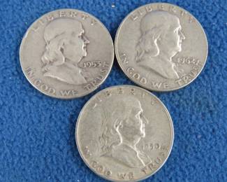 Lot 26. Three Benjamin Franklin silver half-dollars
