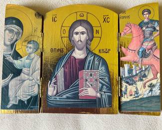 Greek Orthodox triptych icon featuring Jesus Christ Pantocrator in the center, flanked by other religious figures.