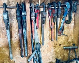 Assorted pipe, wrenches
