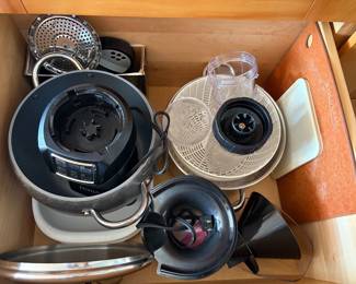 Full kitchen with pots and pans and small appliances.