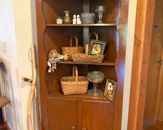 corner cabinet, baskets, decor