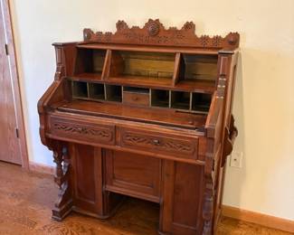 antique pump organ repurposed as a desk