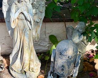 Large, weathered concrete standing angel statue and Star Wars R2-D2 Lawn Ornament