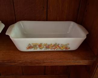 Vintage Anchor Hocking Fire-King loaf pan featuring the "Harvest Vegetable" pattern