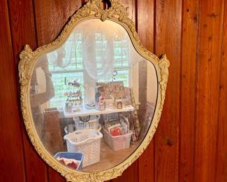 Vtg. French Provincial style wall mirror featuring an ornate, cream-colored frame