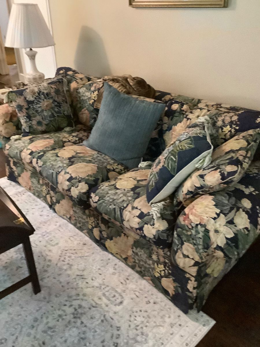 Beautiful Henredon couch in navy back ground cover with flowers. Needs a tear fixed in the arm, but in great condition beside that. Price: $75.00