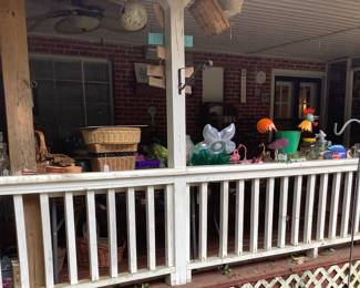 Lots of baskets on covered pirch.