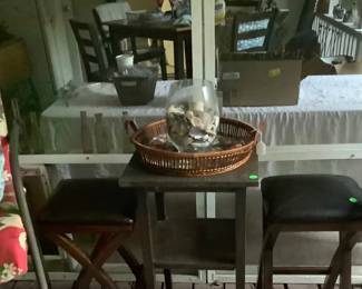 Blackwood high table between the chairs.