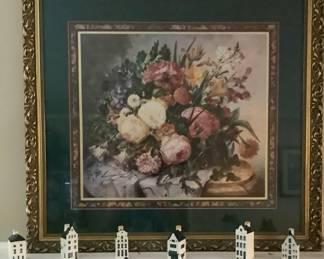 Beautiful picture above fireplace. Little blue & White House’s on mantle.
