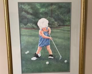 The little boy playing golf.