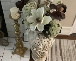 Beautiful tall vase with flowers on front and beautiful flowers inside.