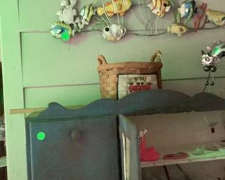 Metal fish wall hanging above Hoosier. Hoosier is: Price: $60.00