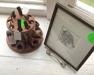 More collectible pipes in stand.
