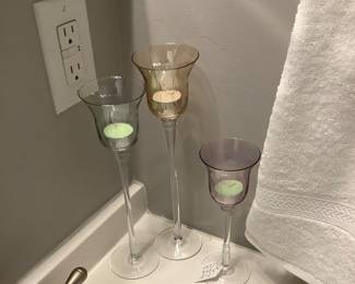 3 tall colored crystal candle holders.