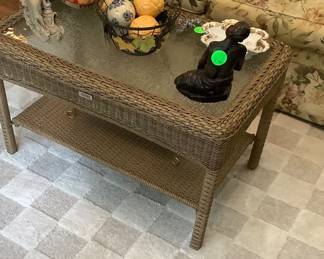 Wicker coffee table with glass and bottom shelf. Price: $90.00