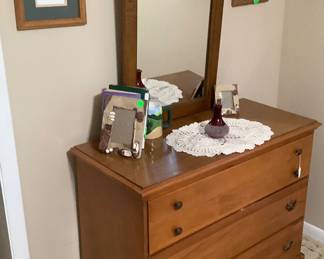 Small maple dresser with mirror and bronze handles. Price: $120.00