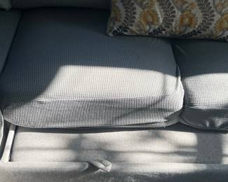 Gray Textured Sofa with Decorative Pillow
