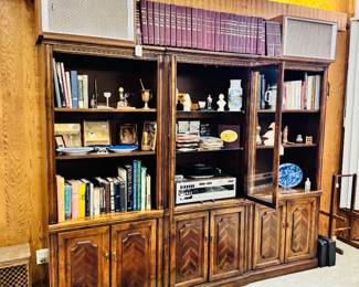 several nice bookcases throughout the home, stereo equipment, books, decor