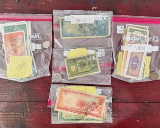 coins and paper currency from all over the world, some silver