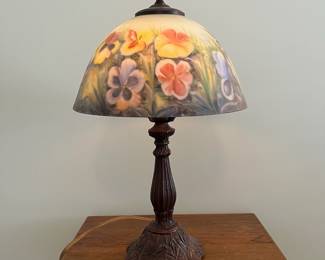 M35 - $40. Table Lamp with Painted Glass Shade. Tiffany Style with Pansy Design. Measures 18.5" tall.