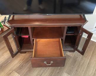 M3 - $35. TV / Media Cabinet. (Holding a 55" TV in this photo) Measures 43" wide x 25.5" deep x 25" tall.