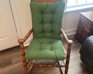 M24 - $40. Wooden Rocking Chair with Rush Seat. Green Cushion is removeable. Measures 24" wide x 30.5" deep x 37.5" tall. Floor to seat is 17".