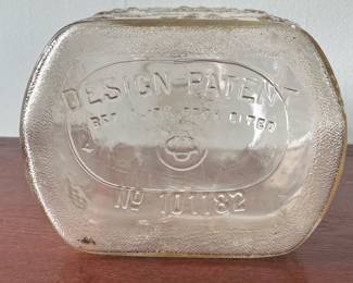 M19 - $20. Garrett's 1 Gallon American Wine. The glass is a faint peach color. Measures 6.75" wide x 5.25" x 11.5" tall.