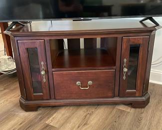 M3 - $35. TV / Media Cabinet. (Holding a 55" TV in this photo) Measures 43" wide x 25.5" deep x 25" tall.