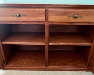 M12 - $75. Buffet / Server in Cedar Finish. C.J. Woodmaster. Very good condition. Measures 49.25" x 17.5" x 34" tall.