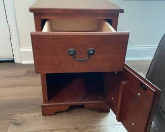 M37 - $30. Single Side Table. Measures 15" wide x 25" deep x 22" tall. One drawer. Bottom is a door. There is another storage area on the back that pulls open as well.