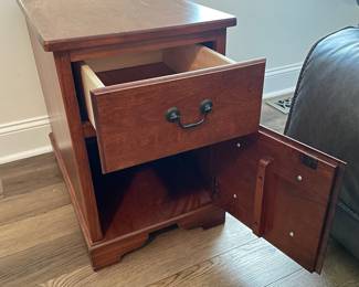 M37 - $30. Single Side Table. Measures 15" wide x 25" deep x 22" tall. One drawer. Bottom is a door. There is another storage area on the back that pulls open as well.