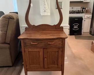 M42 - $125. Antique Wash Stand with Towel Bar. Measures 28" x 17.5" x 54.5" tall.