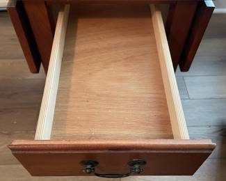 M28 - $20. Drop leaf side table. Measures 30" wide with leaves out. 15" wide when leaves are down. 25" deep x 25.25" tall. Sturdy! Great project piece. Does have wear on the top and water ring on the shelf.