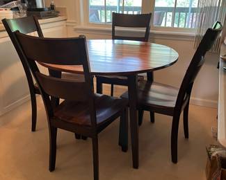 M45 - $125. Round dining table with 4 chairs. Measures 42" round x 30" tall. Sturdy and in good condition!